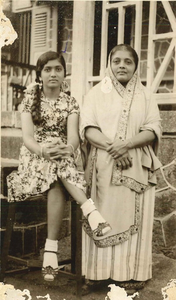 Tajbibi at 16, posed with her mother