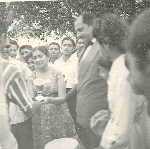 Tajbibi presenting a sports trophy in Laurenco Marques (renamed in 1976 to Maputo), Mozambique, late 1950s