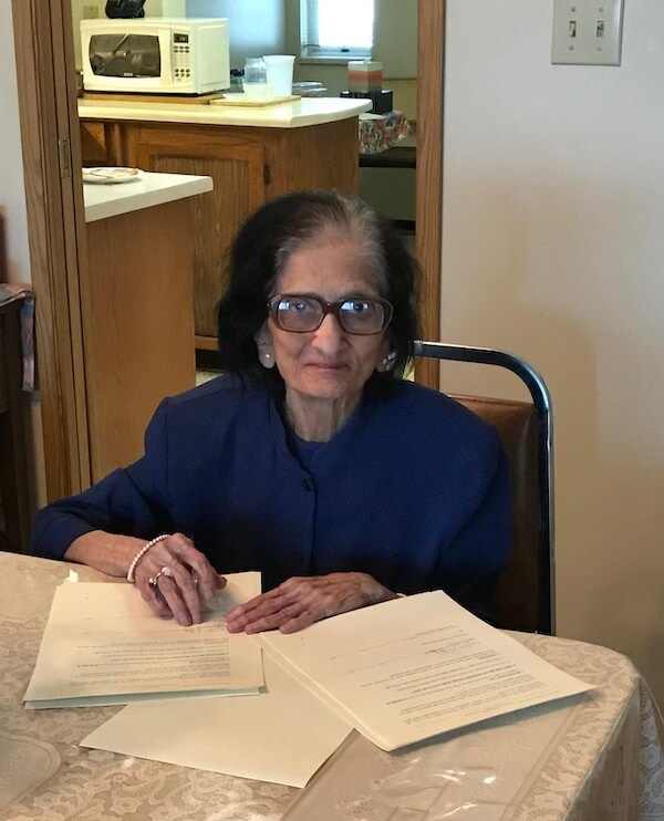 Tajbibi signing the Deed of Gift donating the Abualy Collection to the University of Toronto, 2018